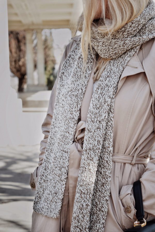 Cream knitted scarf with textured stitch pattern draped elegantly - Nora Scarf knitting pattern by Darling Jadore