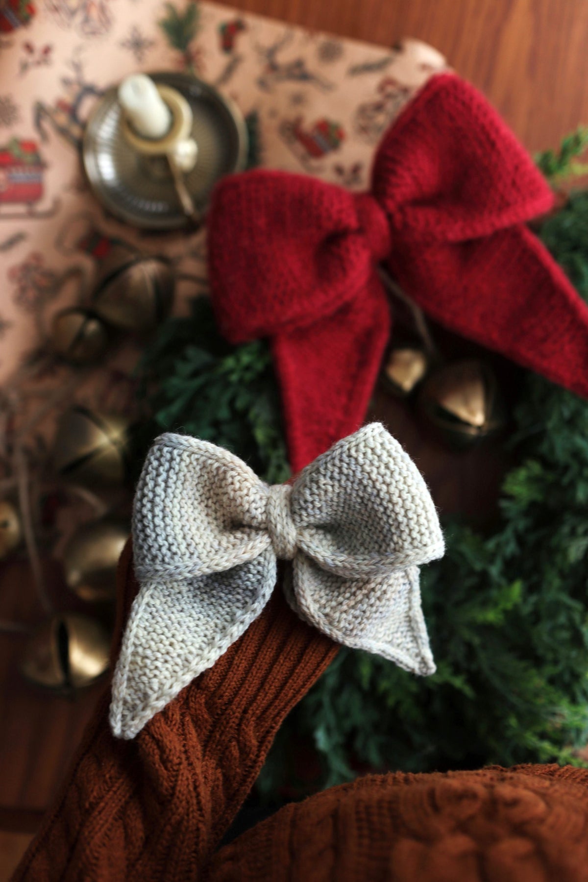 Soft cream knitted bow with elegant loops and sculptural garter stitch texture