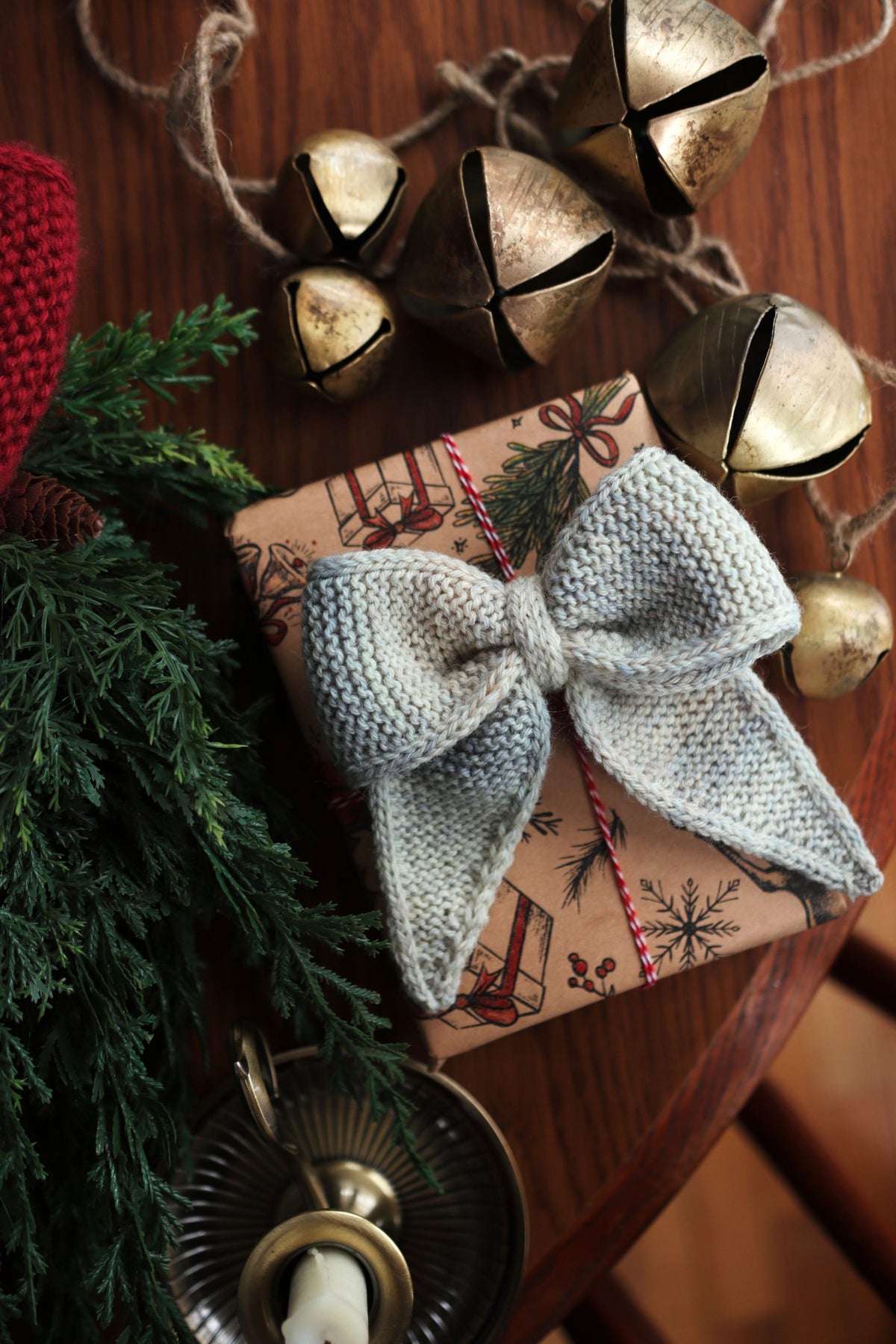 Red knitted bow ornament with perfect loops and tails - festive Christmas knitting pattern by Darling Jadore