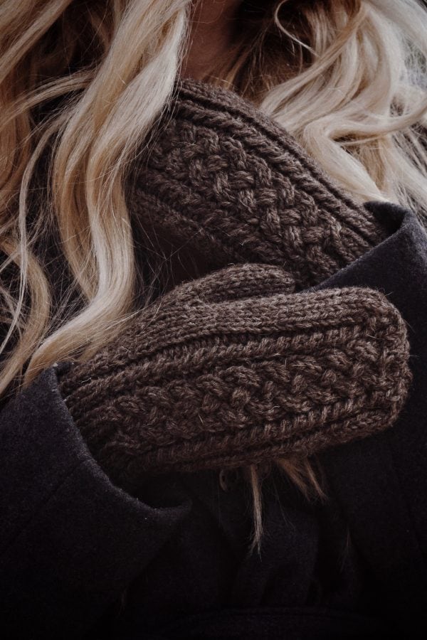 Cable knit mittens in cream yarn showing textured stitch detail - Grove Mittens knitting pattern by Darling Jadore