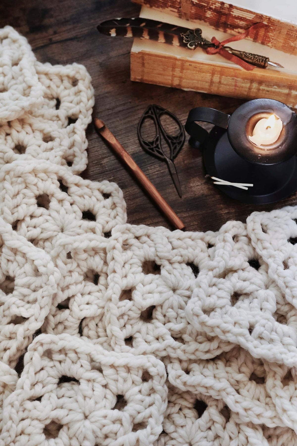 Cream granny square blanket draped over chair - Magnolia Throw crochet pattern by Darling Jadore