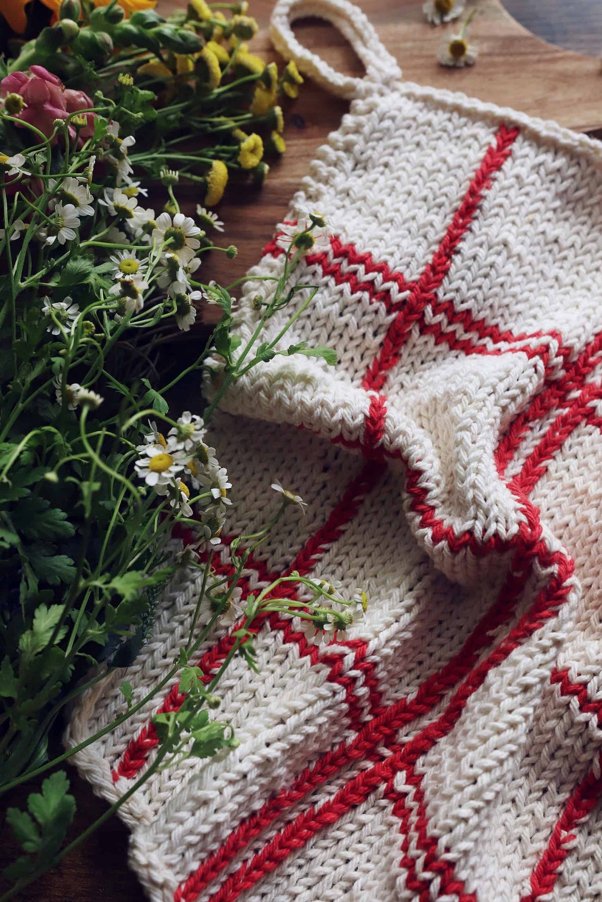 Eco-friendly knitted kitchen towel in classic tartan plaid pattern close-up detail