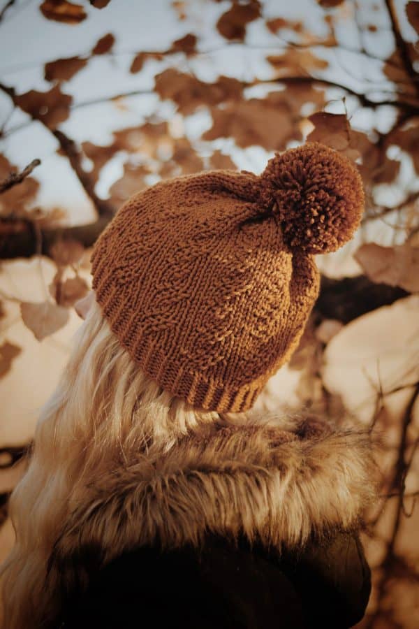Cable knit beanie in cream yarn with textured stitch detail - Prairie beanie knitting pattern by Darling Jadore