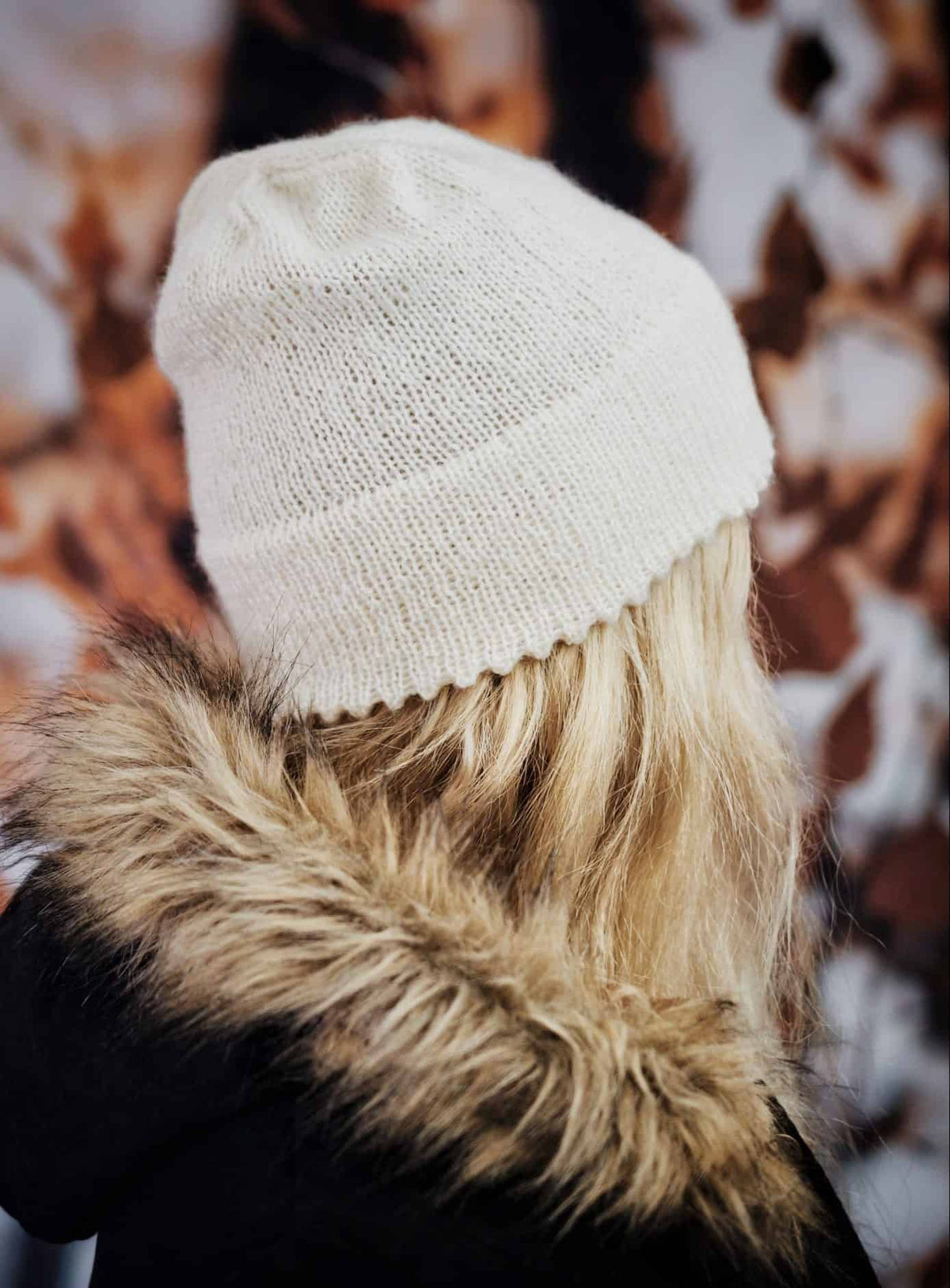 Cream knitted beanie with textured icicle stitch pattern displayed on wooden surface - Darling Jadore knitting pattern