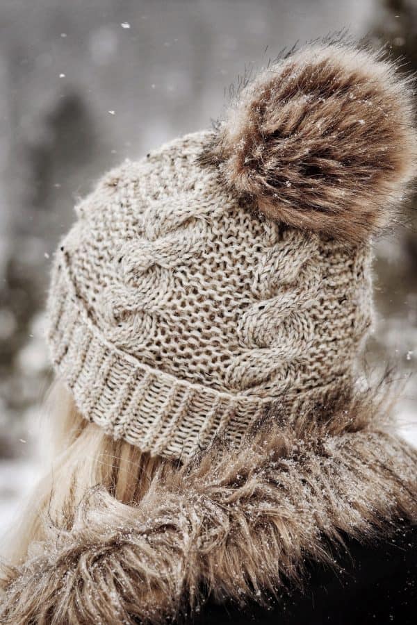 Cable knit beanie in cream yarn showing textured stitch pattern - Timber Beanie knitting pattern by Darling Jadore