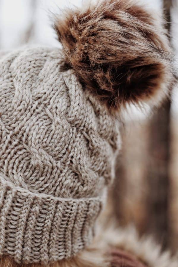 Cable knit beanie in cedar brown yarn showing textured stitch detail - Cedar Beanie knitting pattern by Darling Jadore