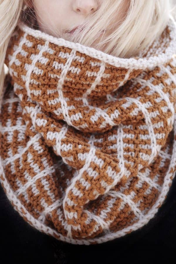 Knitted cowl in warm harvest tones worn around neck - Harvest Cowl knitting pattern by Darling Jadore