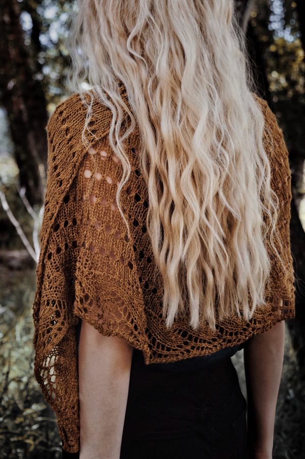 Mustard yellow lace knit shawl draped over shoulders showing delicate stitch detail - Darling Jadore knitting pattern