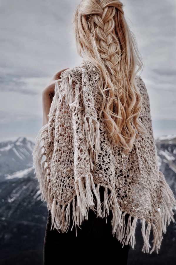 Square lace shawl knitting pattern styled as versatile wrap