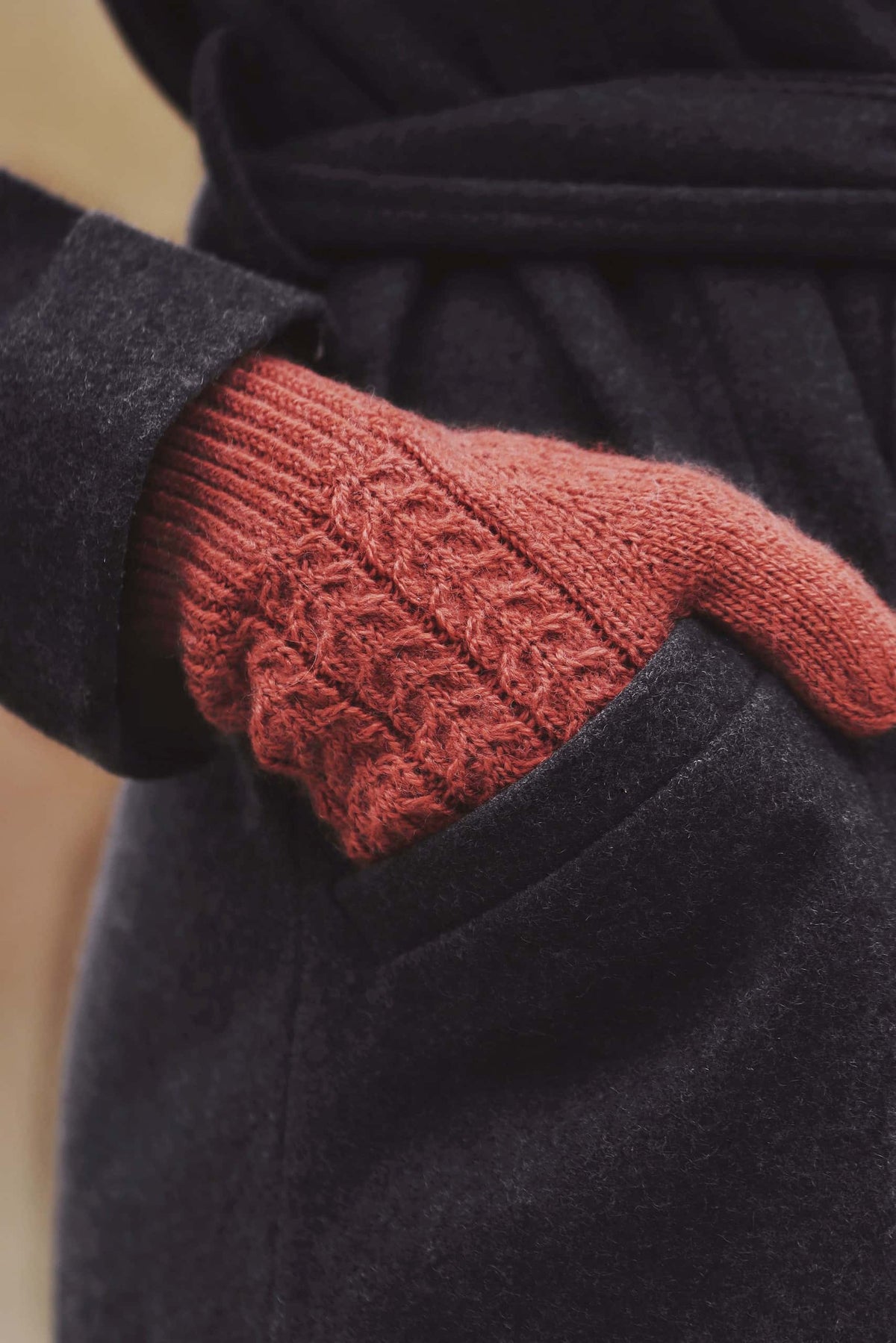 Elegant cable gloves knitting pattern displayed flat showing full glove design
