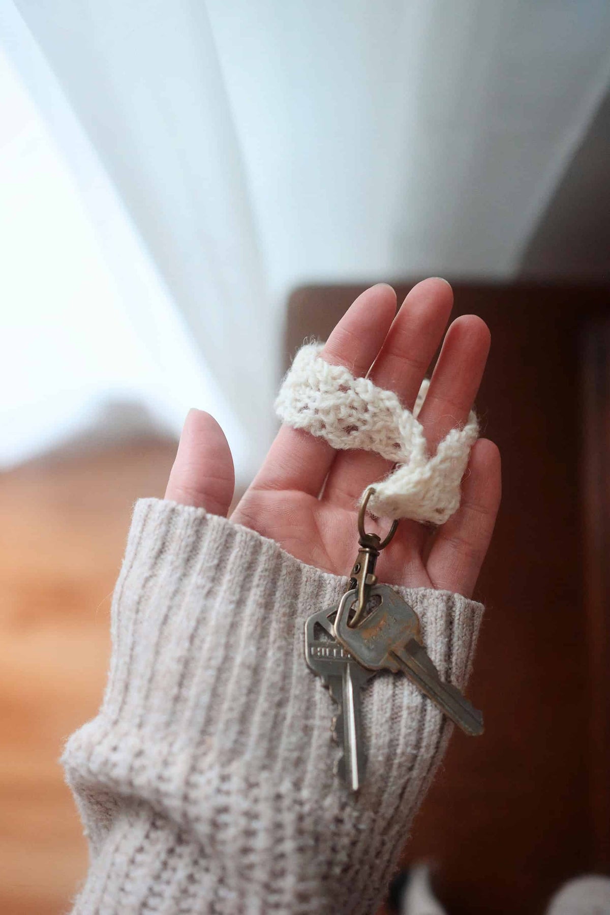 Easy beginner-friendly lace keychain knitting pattern showing elegant design details