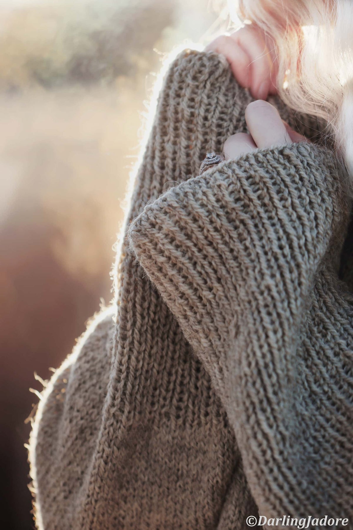Chunky knit raglan sweater in cream yarn showing seamless construction - beginner-friendly sweater pattern by Darling Jadore