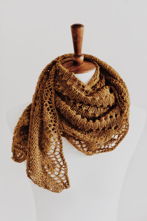 Close-up of Ruska shawl eyelet lace pattern with delicate wave border knitting detail