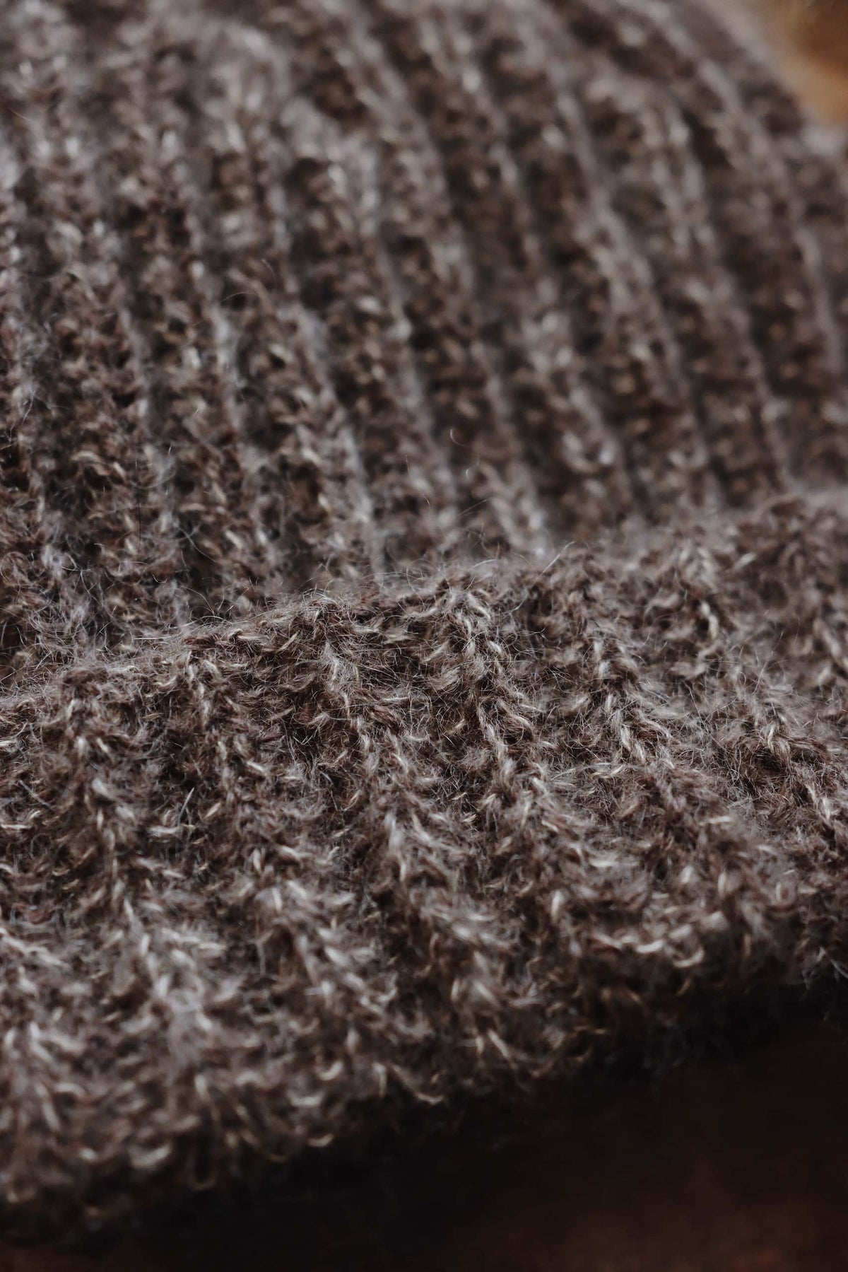 Side view of The Oakwood beanie showing fold-over brim and ribbed texture knitting pattern