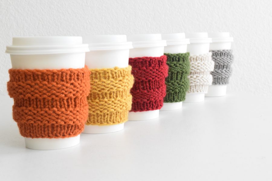 Coffee cozy knitting pattern styled with autumn beverage and cozy setting