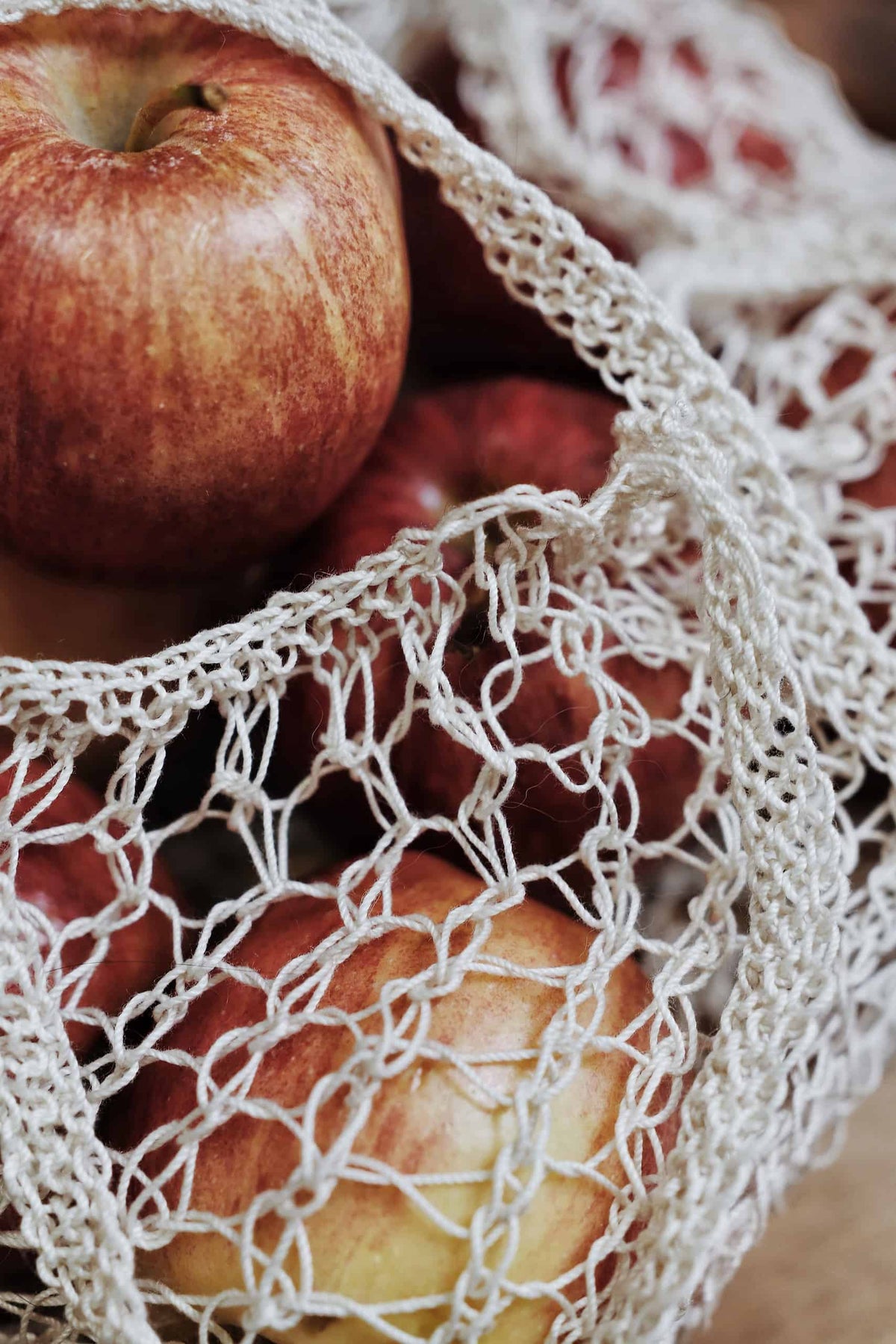 Close-up of mesh produce bag knitting pattern texture showing open stitch work