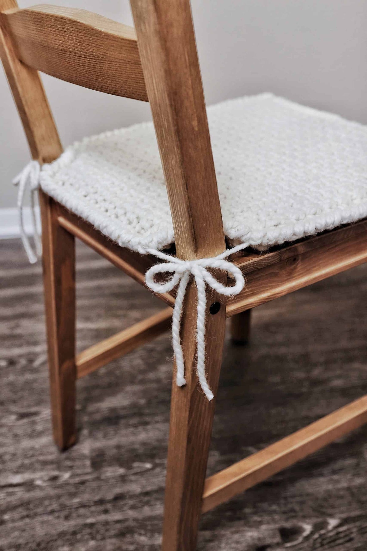 Close-up of woven texture crochet chair cushion pattern showing thick cushiony fabric and modern edging detail