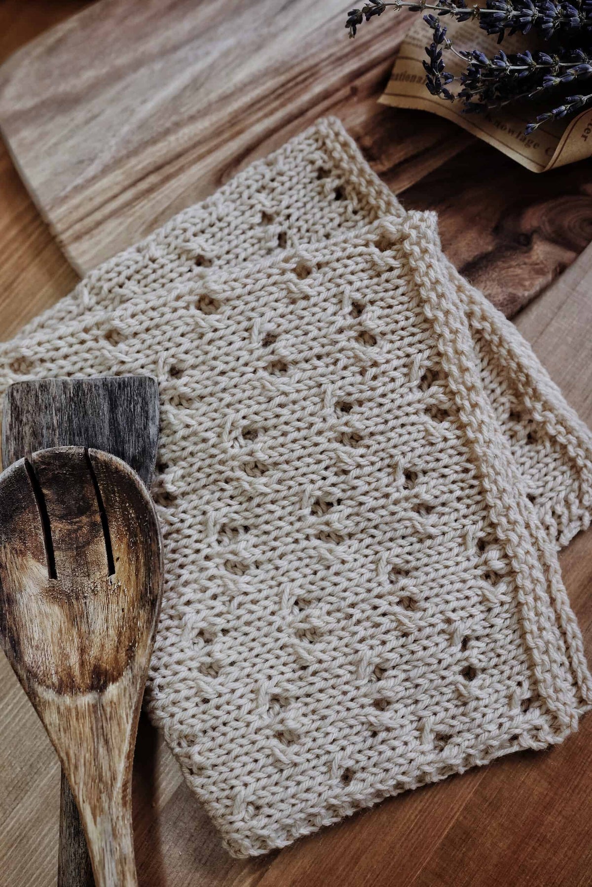 Handmade knit napkin featuring eyelet lace pattern perfect for sustainable farmhouse kitchen