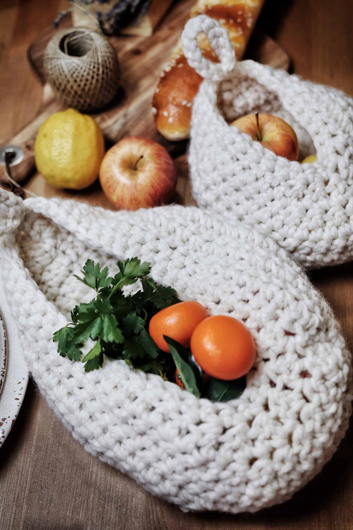 Handmade crochet hanging basket pattern for kitchen organization and storage