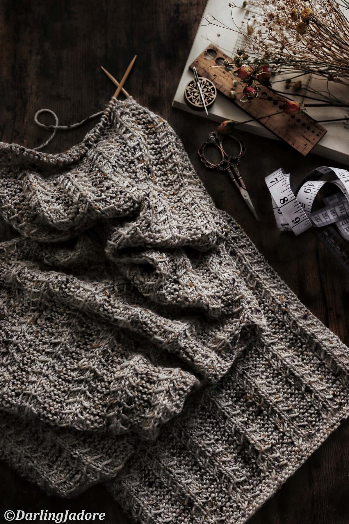 Advanced beginner scarf knitting pattern styled as elegant wrap accessory