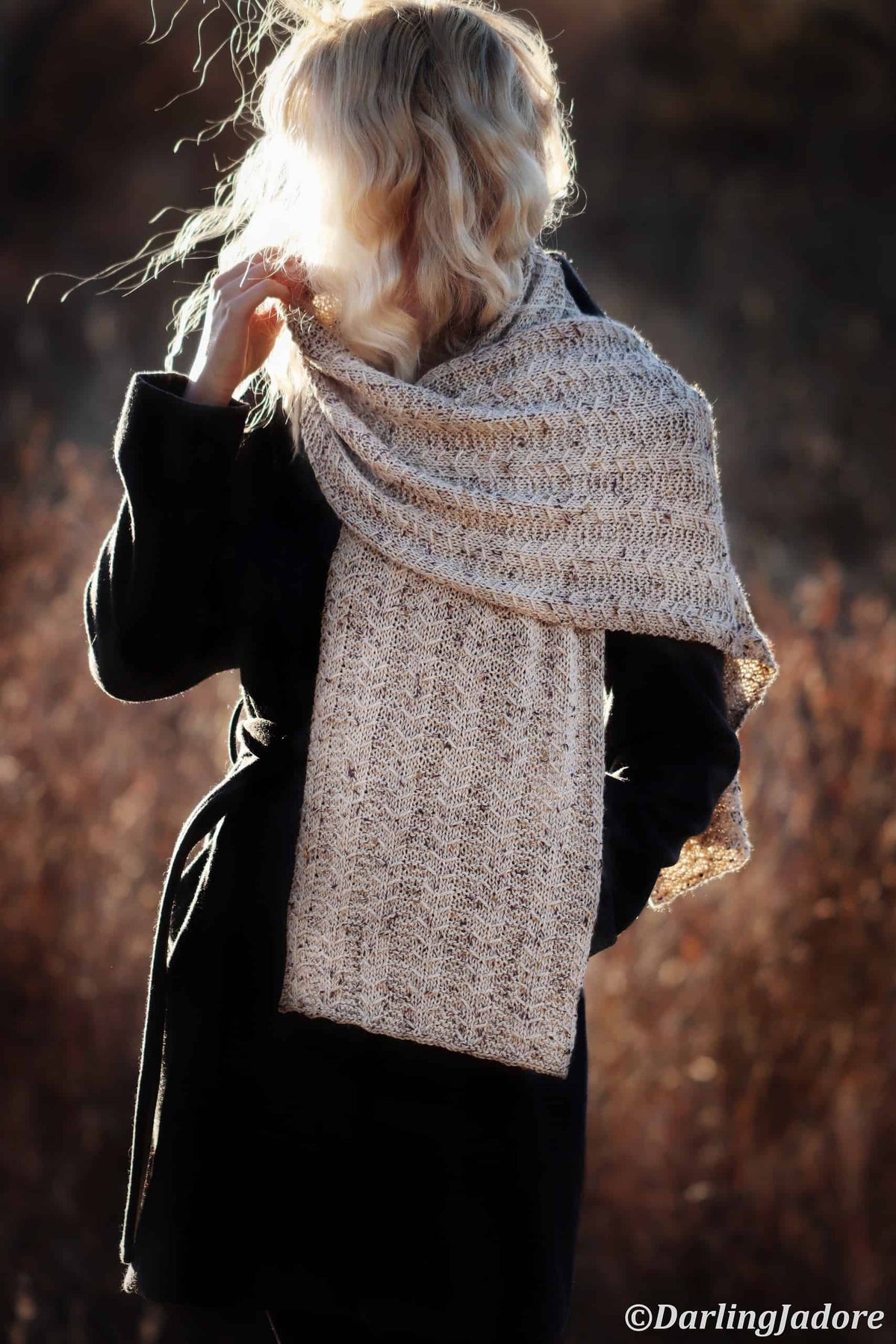 Detailed view of geometric textured scarf pattern with dimensional stitch definition