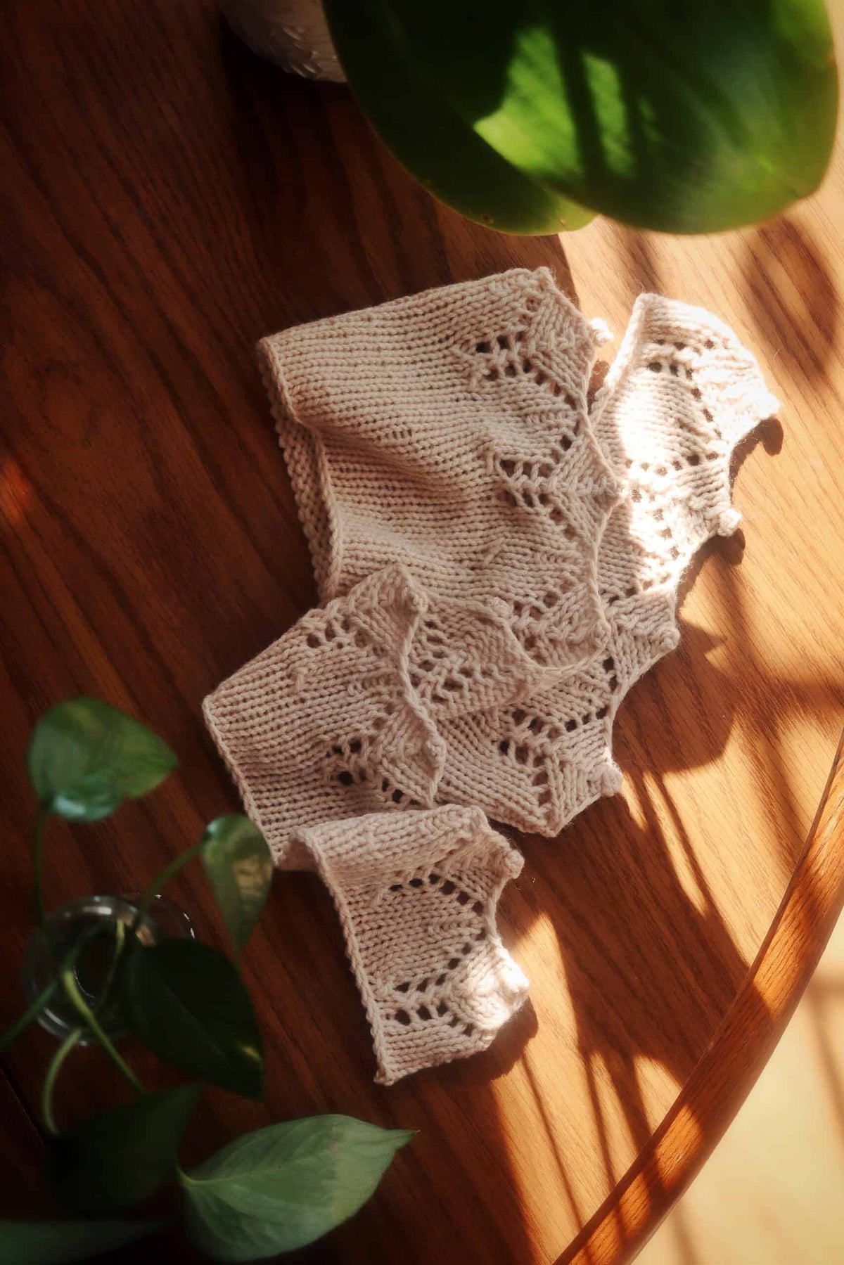 Close-up of intricate lace border on crescent-shaped Bay Scarf knitting pattern