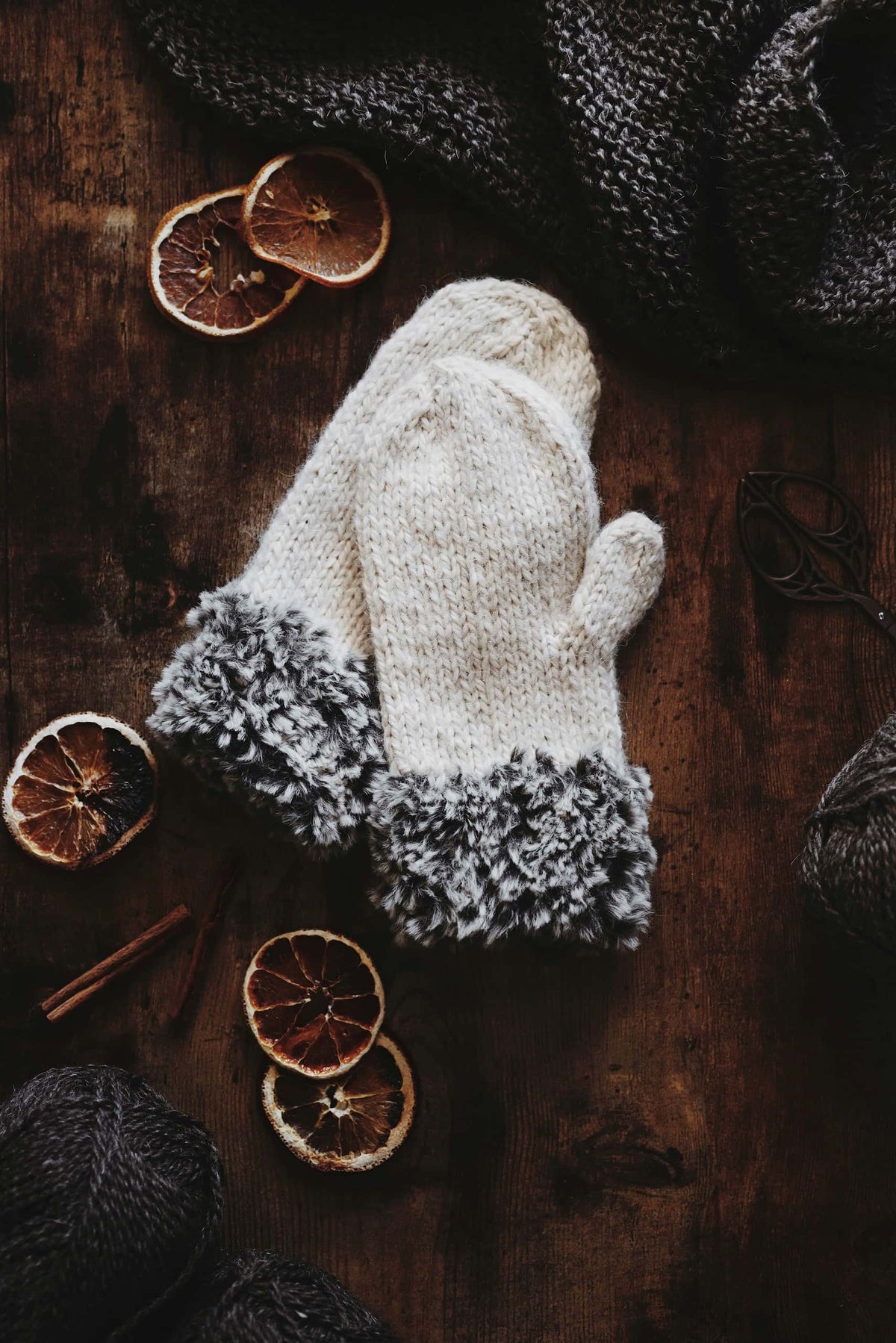 Classic cream mittens with faux fur trim knitting pattern styled for winter elegance