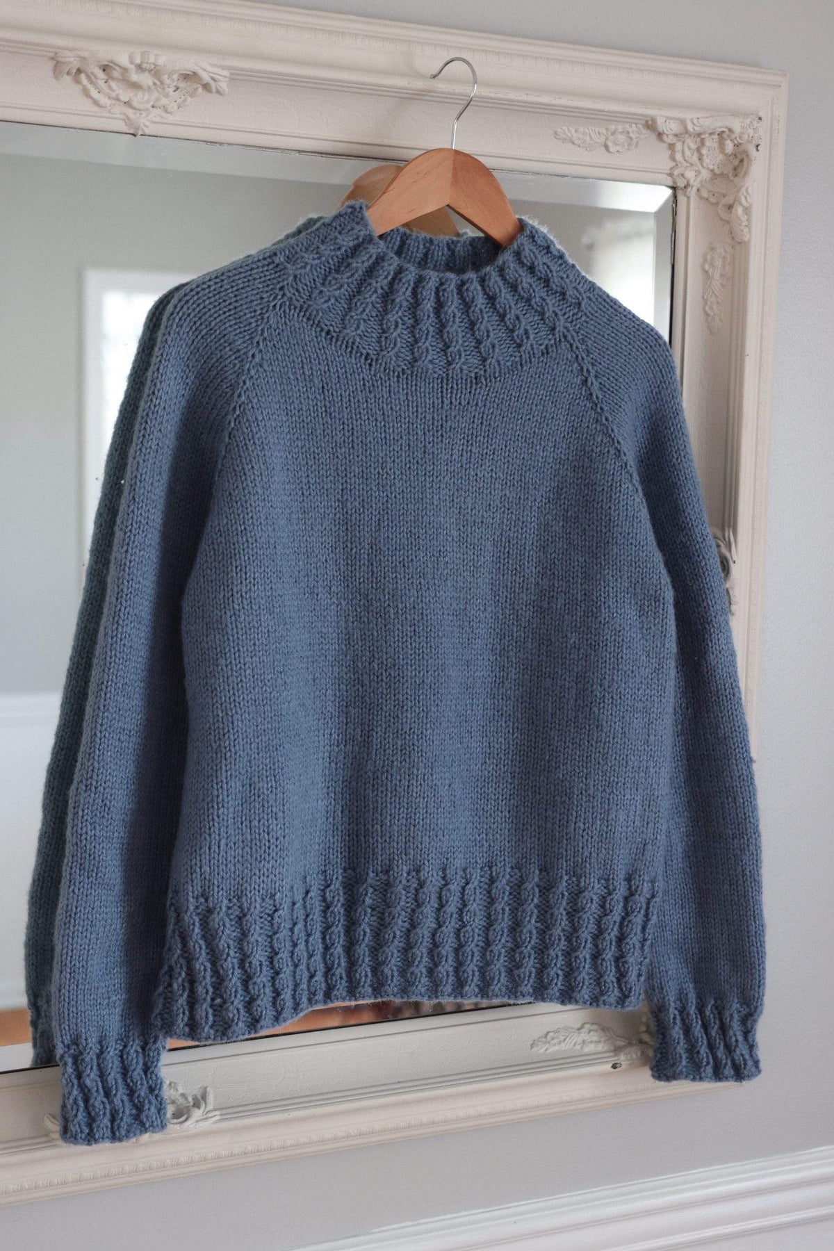 Close-up of cable knit detail on Mistfall Sweater sleeve in worsted weight yarn