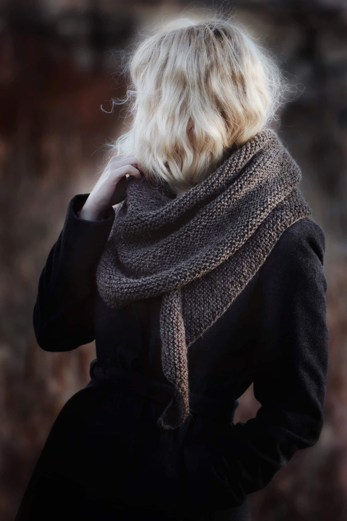 The Canyon Scarf beginner-friendly boomerang scarf pattern worn casually