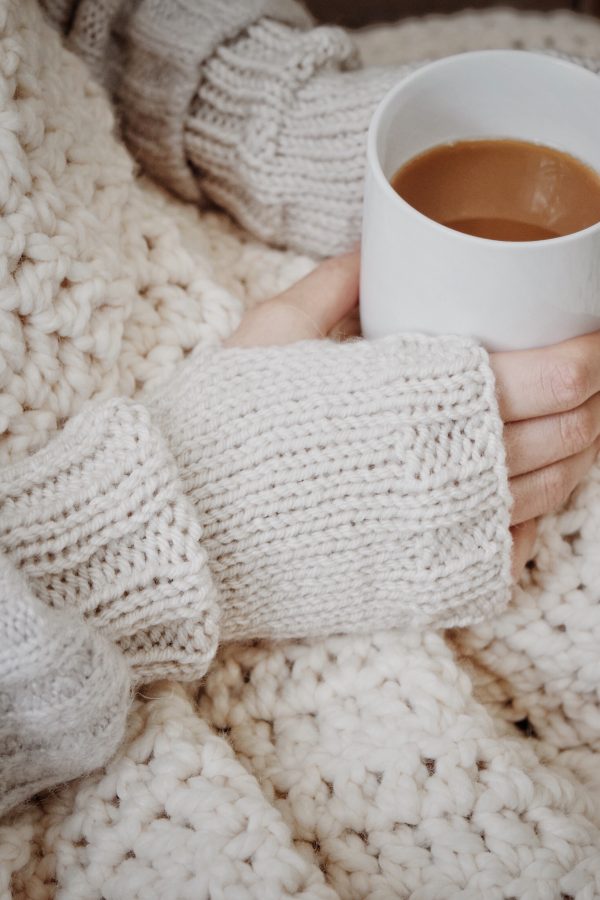 Oakridge fingerless gloves pattern styled on hands showing versatile wrist warmer design