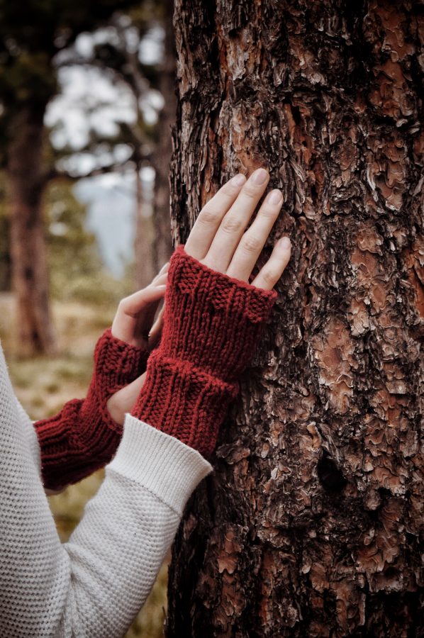 Oakridge fingerless gloves knitting pattern worn on hands showing classic ribbed cuff and open top design