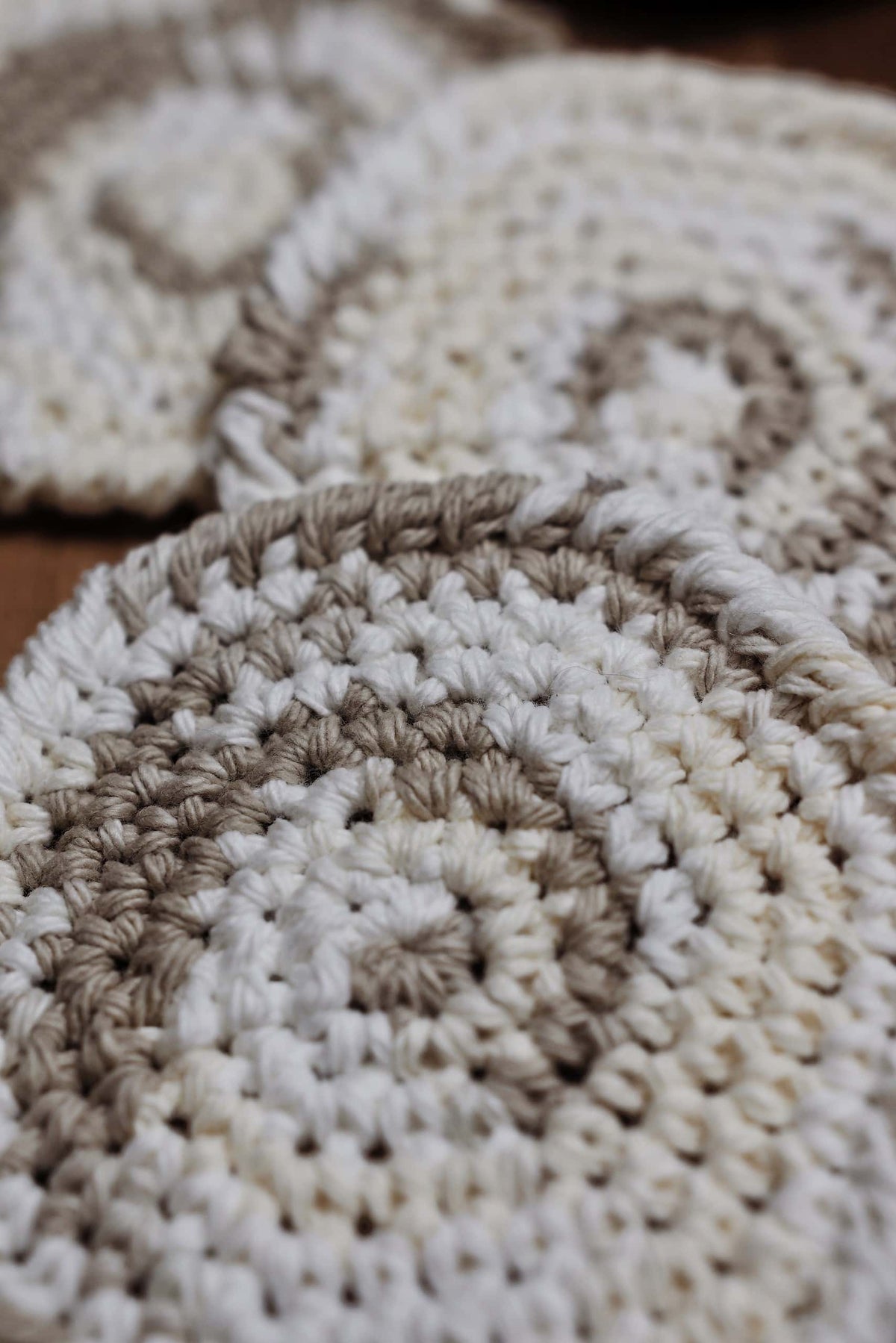 Handmade round crochet coaster with structured rope-like border - beginner friendly coaster crochet pattern
