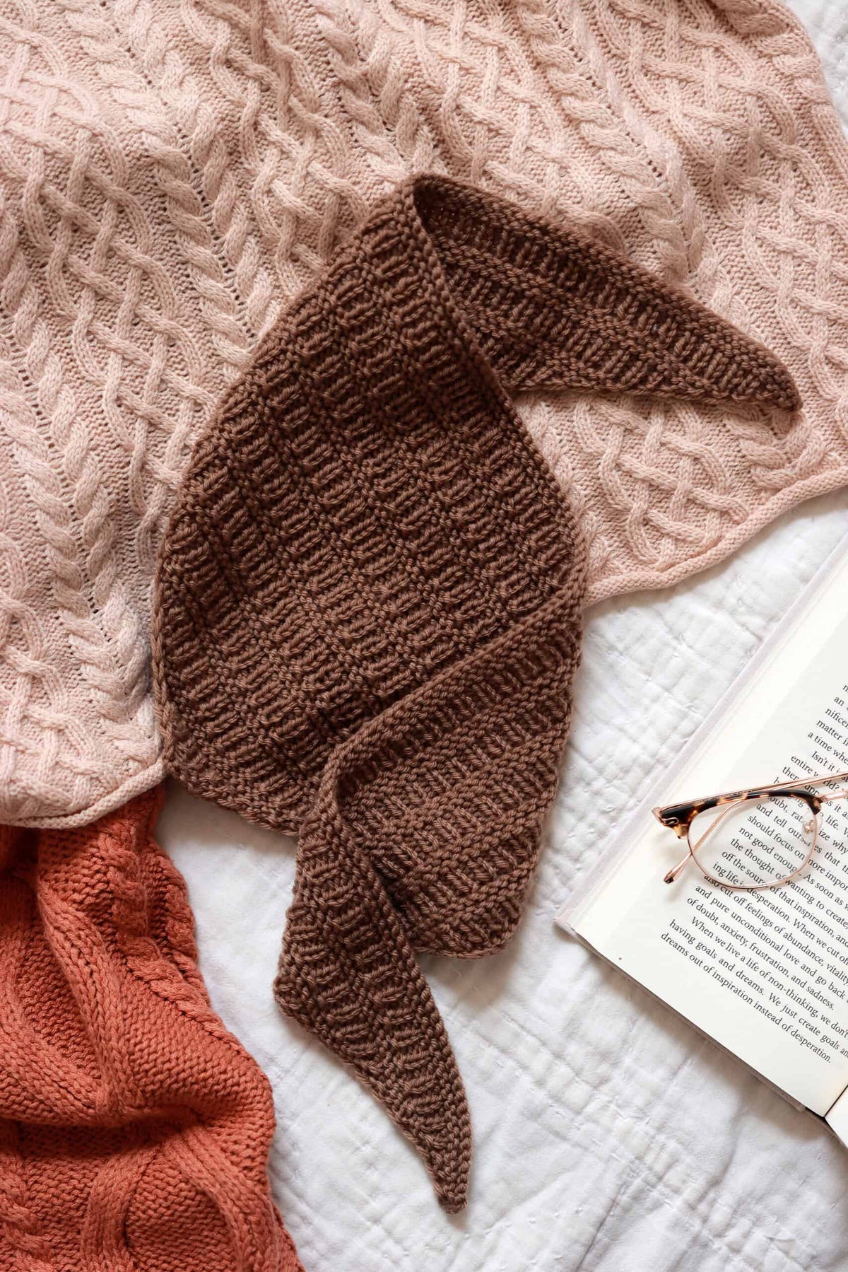 Scarflette knitting pattern in neutral yarn showing elegant drape