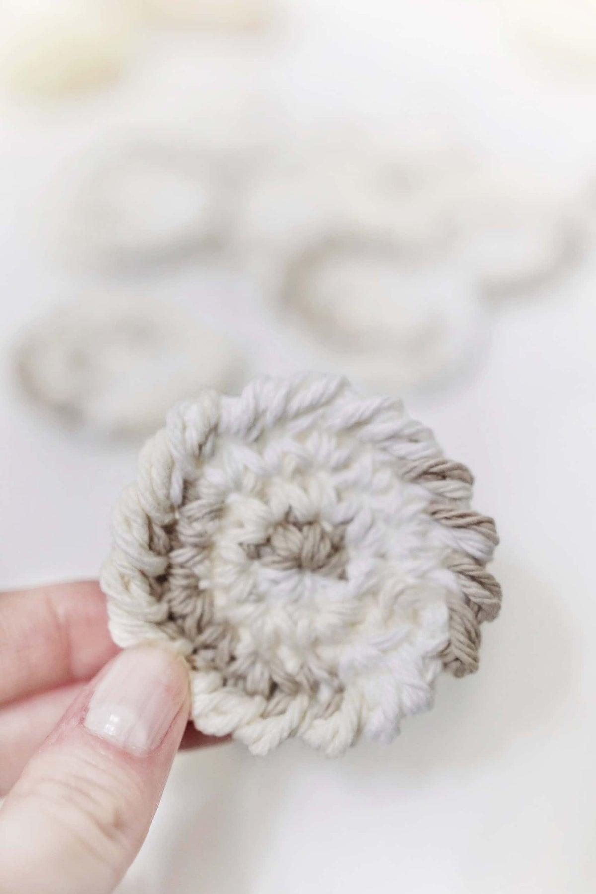Close-up of eco-friendly crochet makeup remover pads showing stitch detail and texture