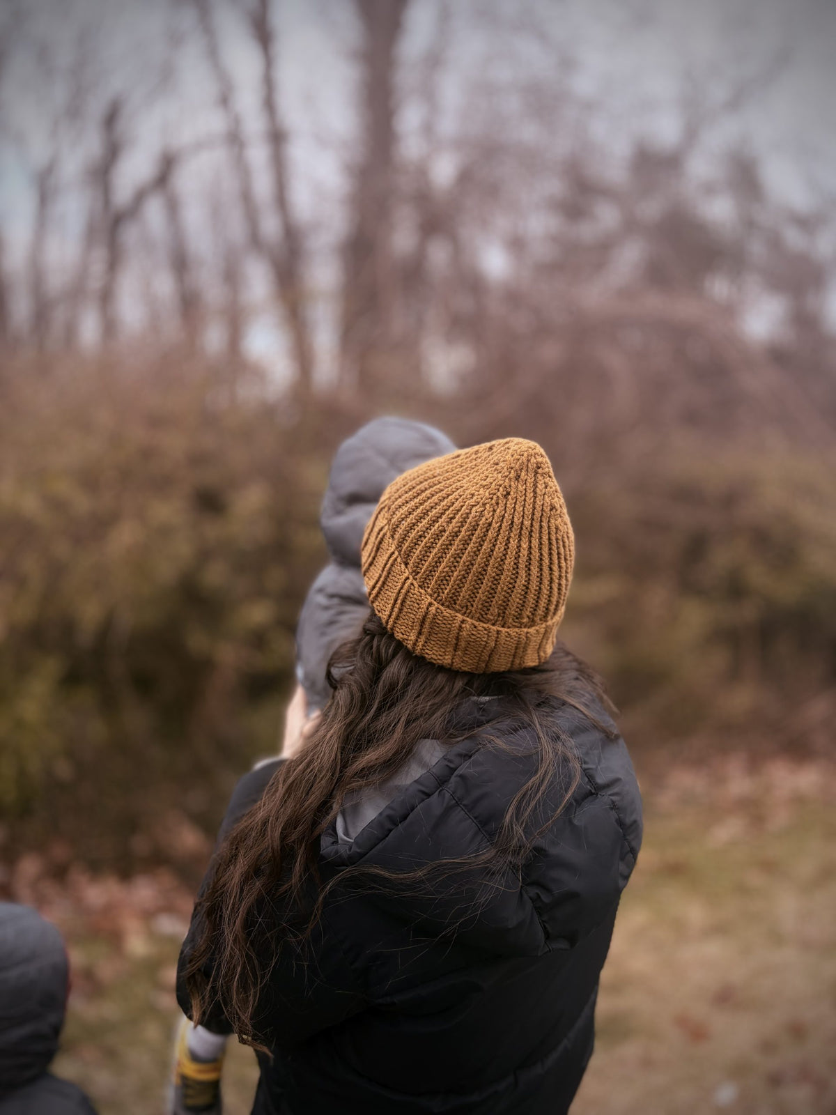 Close-up of textured ribbed beanie knitting pattern showing stitch detail