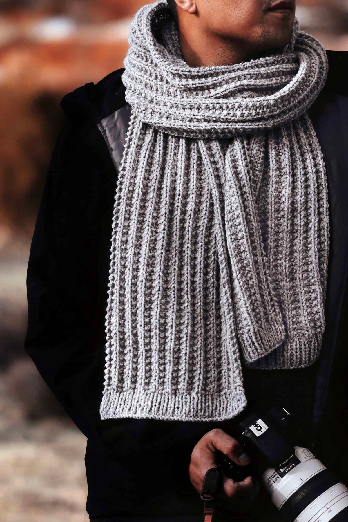 Detailed view of ribbed knit scarf pattern showing classic texture and drape