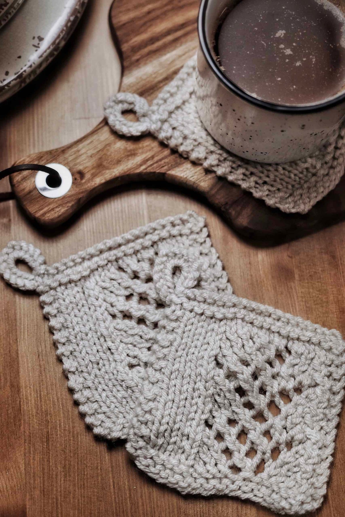 Wheatfield lace coaster knitting pattern styled with mug - beginner-friendly farmhouse decor project