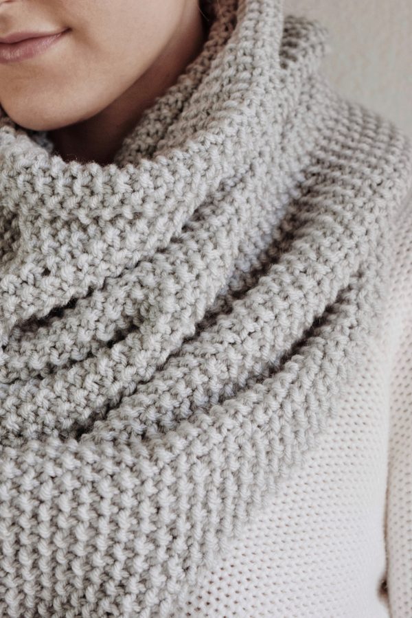 Textured seed stitch infinity scarf worn as cozy cowl - beginner-friendly knit pattern