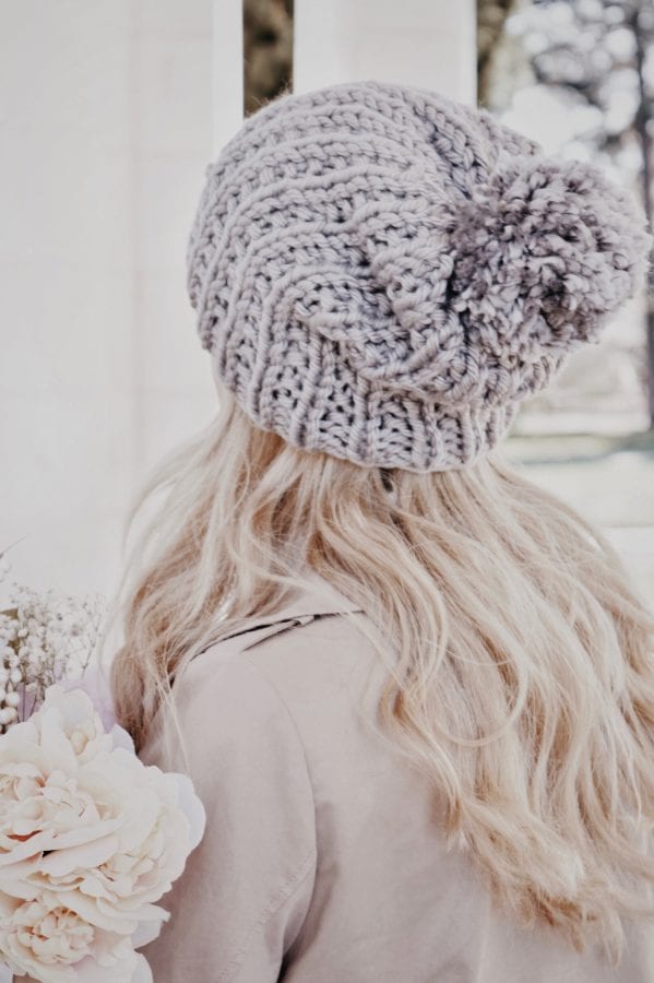 Close up of textured knit stitches on cream chunky beanie with pom - The Brivet Beanie pattern