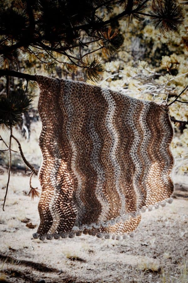 Riverbed wave scarf crochet pattern draped to show chevron ripple design and luxurious drape