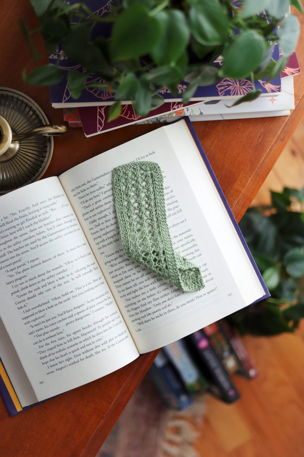 Vintage lace knit bookmark with delicate pattern detail on open book
