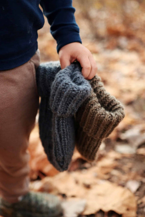 Close-up of textured rib stitch detail on knit toddler beanie pattern