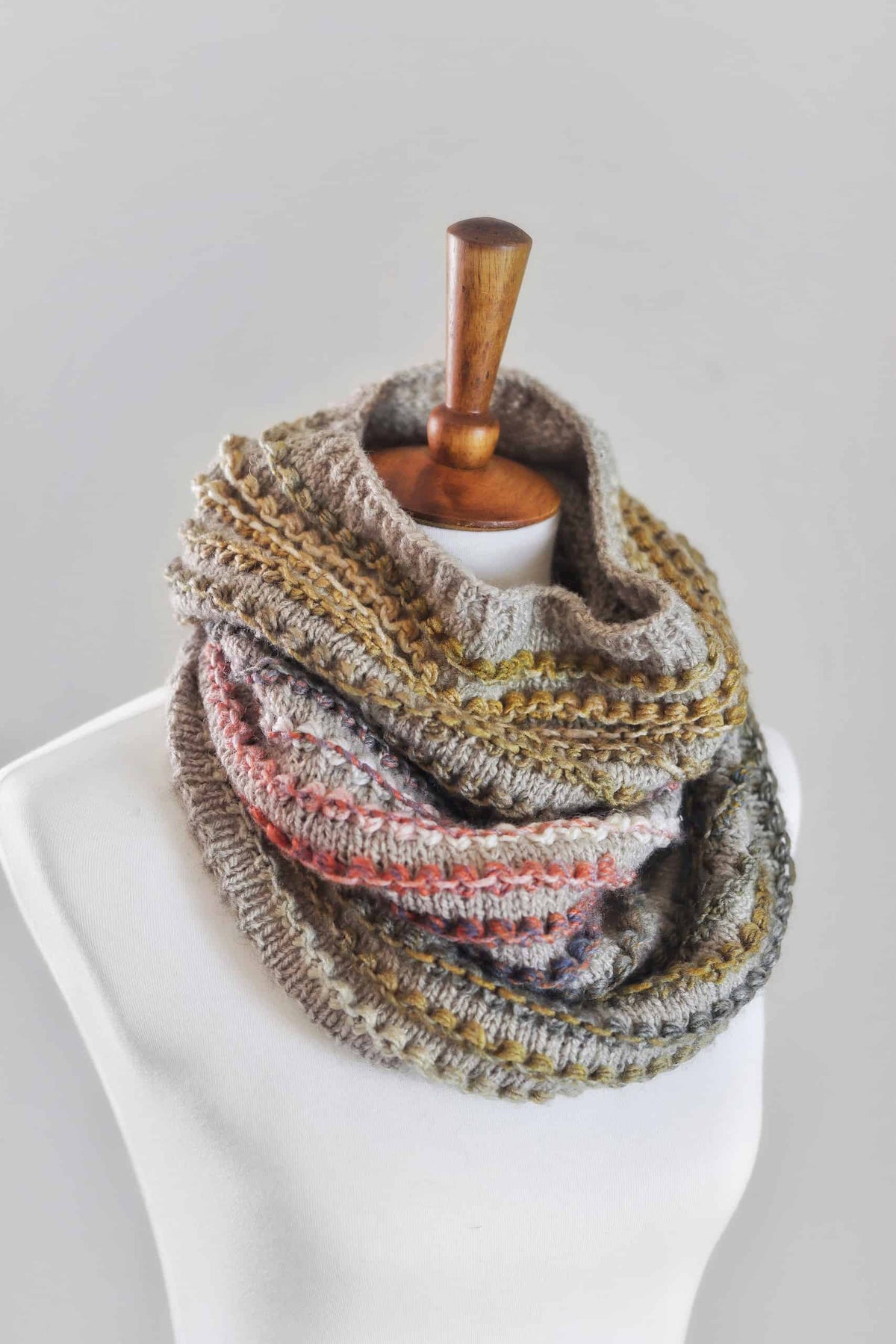Close-up of bobble stitch texture detail on The Rosewood Cowl knitting pattern