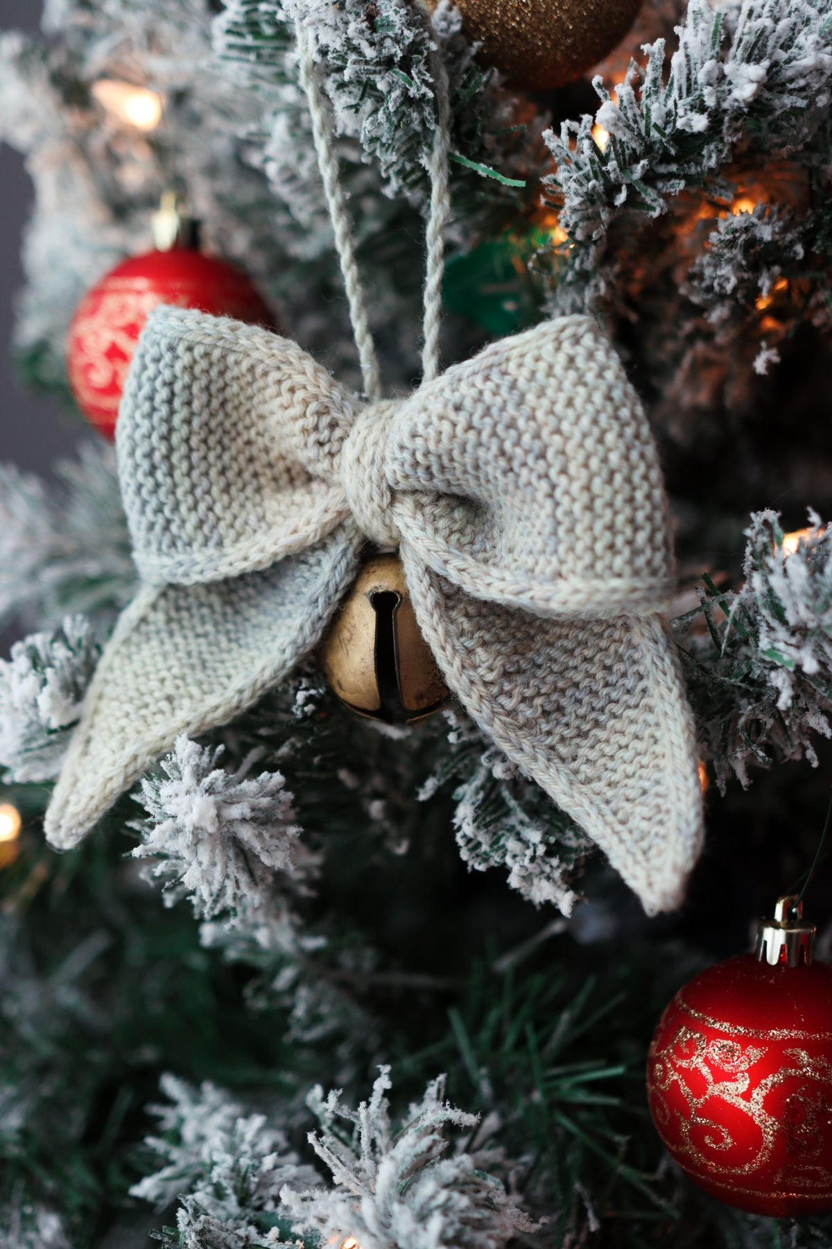 Beginner-friendly knit bow pattern styled as elegant holiday ornament