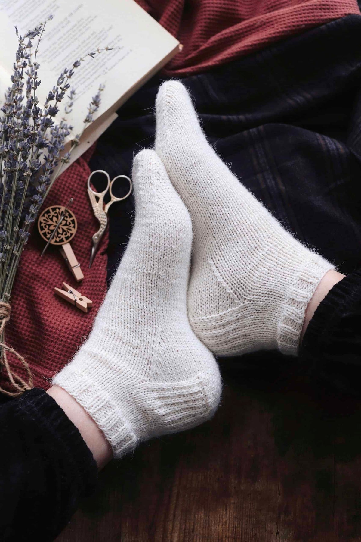 Hand knit classic ankle socks in cream stockinette stitch close up detail