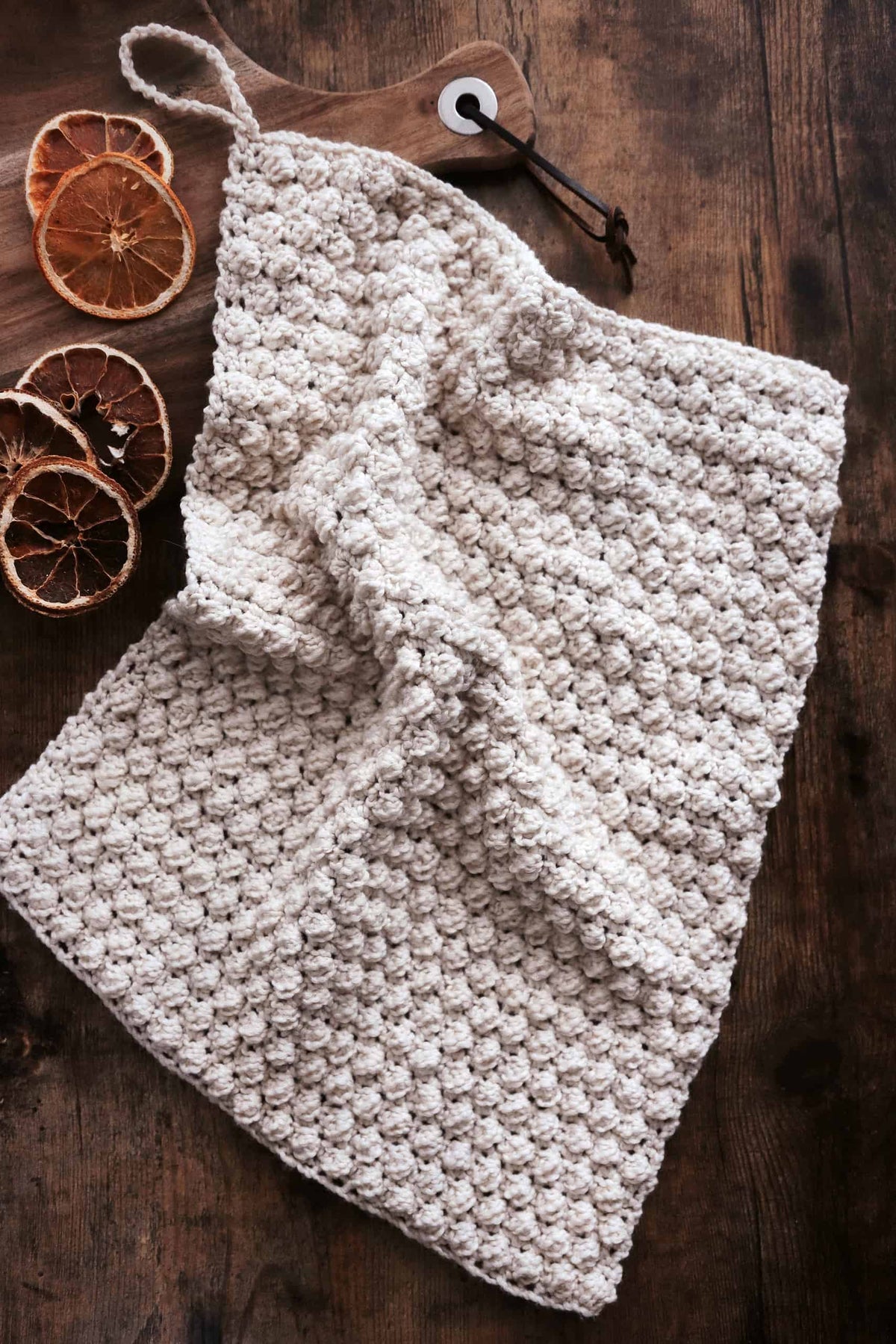 Close up of bobble stitch detail on Coastline tea towel crochet pattern showing texture