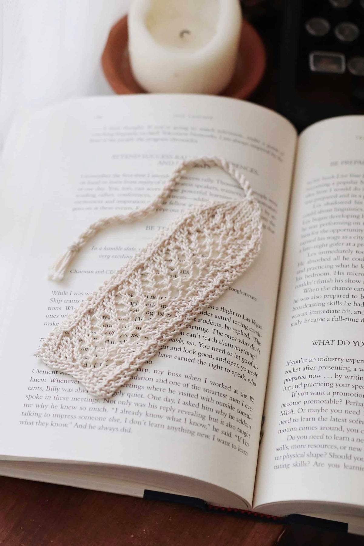 Vintage lace bookmark knitting pattern with delicate cascading design on open book