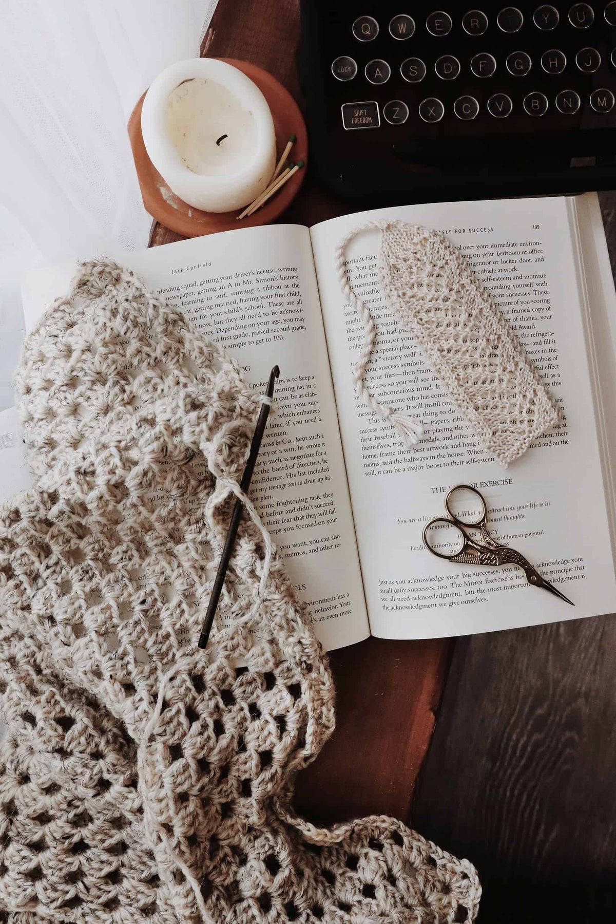 Close-up of romantic vintage-inspired lace knit bookmark showing intricate stitch detail