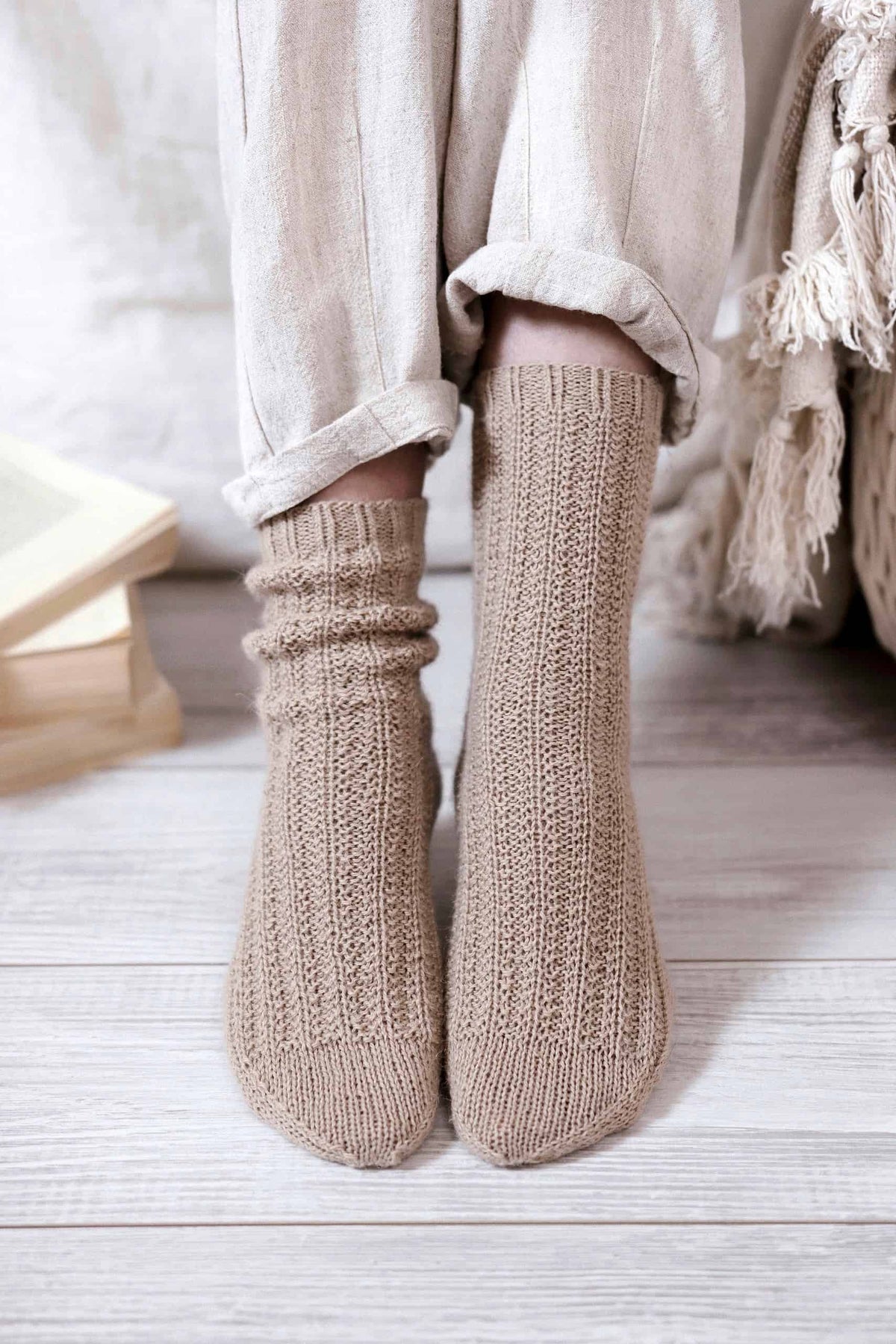 Close up detail of textured ribbed sock knitting pattern stitches