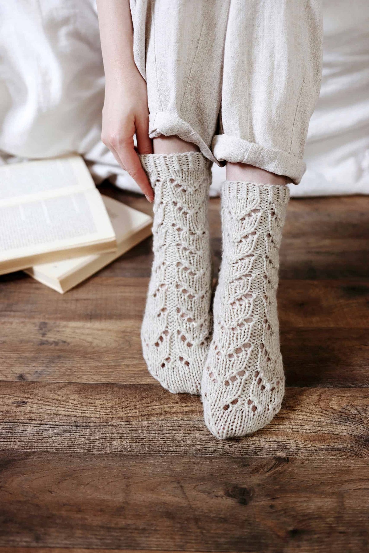 Alpine socks knitting pattern detail showing intricate lace work and timeless design